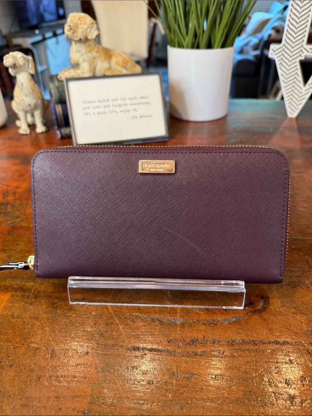 kate spade plum zip-around Saffiano wallet with gold plaque